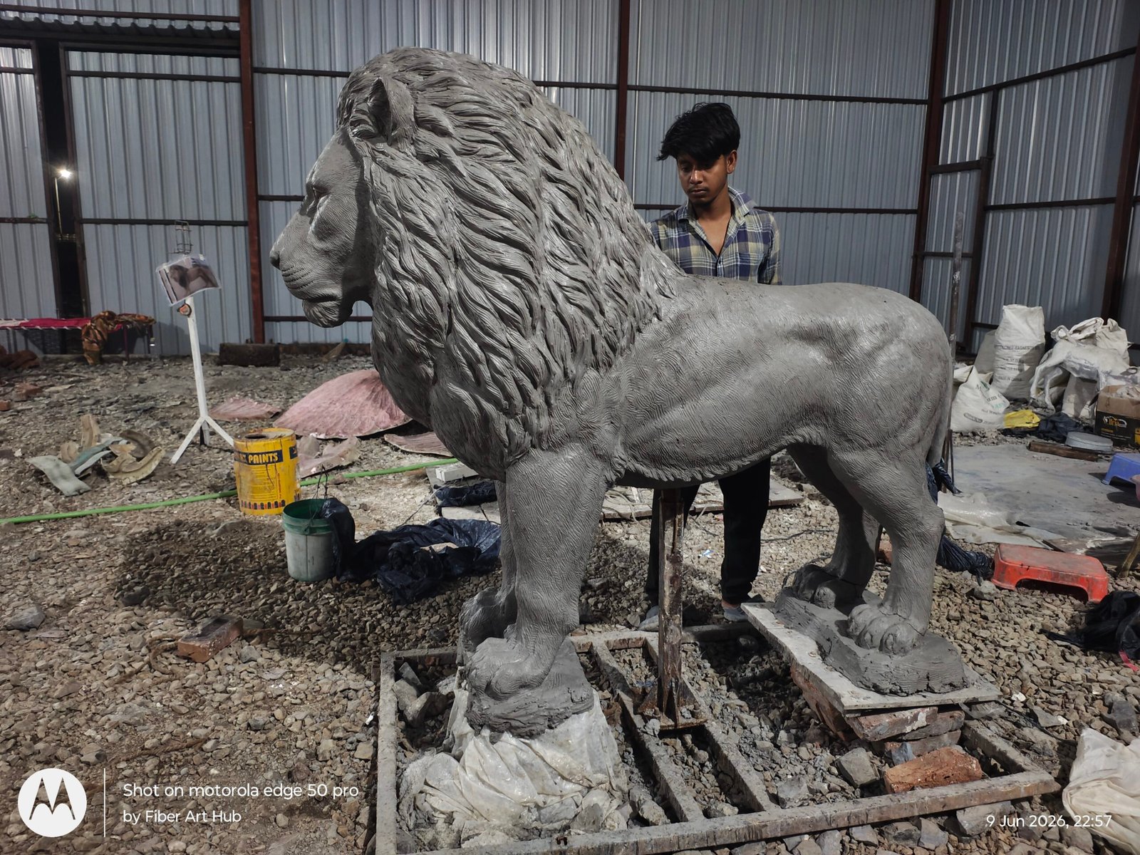 Artist working on sculpture details in an art studio